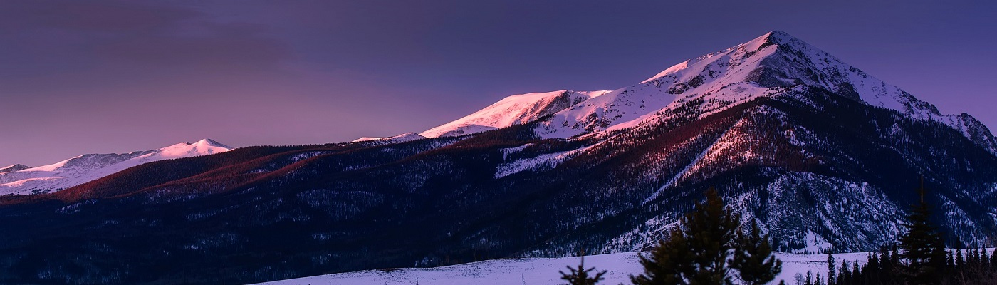 Beatiful mountain with purple sky behind at sunset